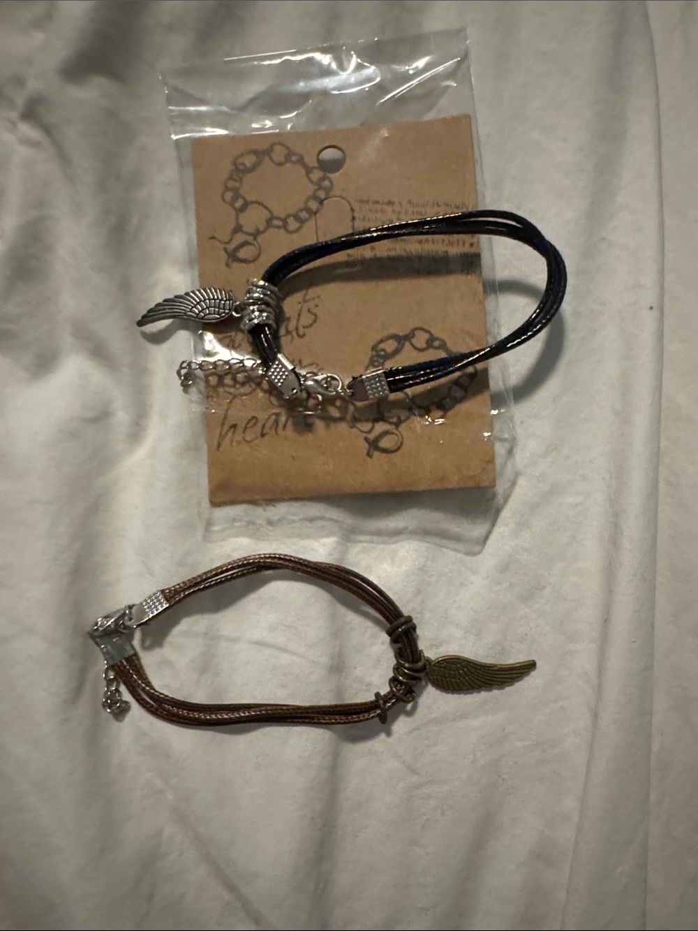 Wing Charm Double Cord Bracelets - Black and Brown
